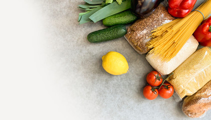 Crisis food products for isolation period. Macaroni, oil, canned food, vegetables, sugar, oatmeal, millet, lemons, ginger. Food Delivery, Donation, Coronavirus Quarantine.