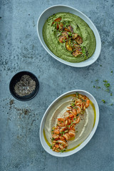 Green hummus with black pepper and shrimps