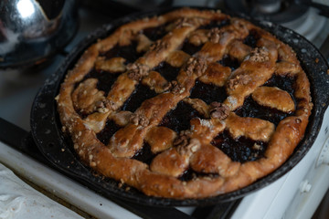 Sweet cake with jam and nuts