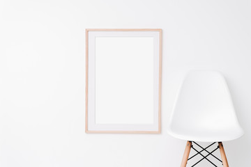 Large wooden oak frame mockup on white wall. Simple modern interior. Art template. Background. Print mockup, posyter mockup