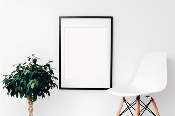 Large Black frame mockup on white wall. Simple modern interior. Art template. Background. Print mockup, posyter mockup