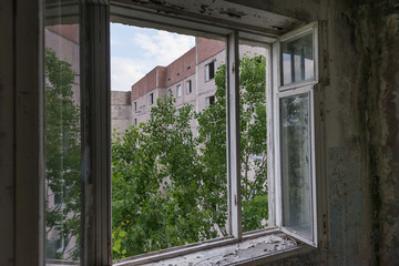 Open window in abandoned ghost town Pripyat in Chernobyl zone