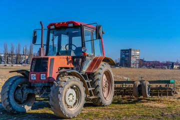 Tractor with trailer in the field