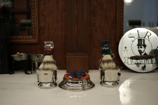 Shaving brushes and razors are seen at Angelos Antonopoulos barbershop that is closed to customers as a precaution against the spread of the coronavirus disease (COVID-19), in Athens