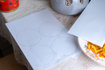 Preparing paper for baking dough