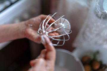 Cream on a whisk after whipping