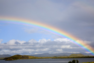 Myvatn / Iceland - August 30, 2017: A spectacular rainbow at lake Myvatn, Iceland, Europe