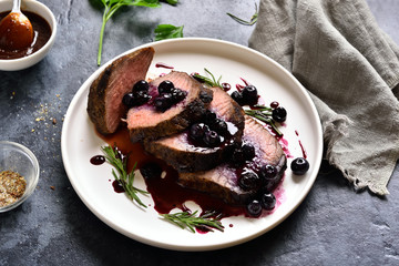 Cooked beef with blueberry sauce