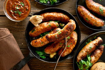 Fried sausages in frying pan