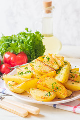 Roasted potato baked in an oven with herbs