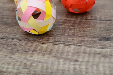 closeup of origami balls on wooden