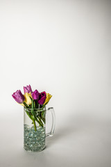 bouquet of tulips in a glass mug