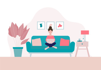 Woman sitting on a sofa with laptop  in her living room in period of self isolation and social distancing during Covid-19 virus epidemic. Stay home concept. Freelance or studying concept.