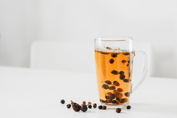 Vitamin Natural tea from the dried rosehips for immunity handmade at home in a light interior