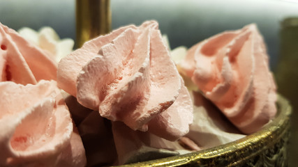 Color sweet homemade meringues and marshmallows. Airy and tender pastry marshmallows dessert. The sweet dish you want to eat. Sweets in the dark