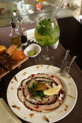 bread, mojito and octopus salad with lemon and cranberries