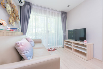 Spacious white and wooden living room with modern 