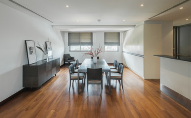 Stylish kitchen interior with dining table and chairs