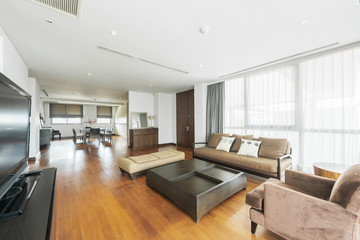 Spacious white and wooden living room with modern 