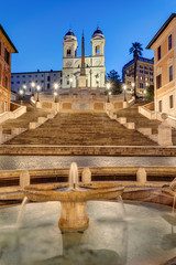 Fototapeta na wymiar The famous Spanish Steps with a fountain in Rome at dawn