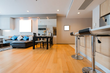 Spacious white and wooden living room with modern 