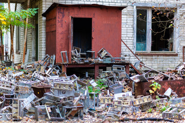 A pile of electronic scrap from the 1980s lying around in the post office of Pripyat, Chernobyl...
