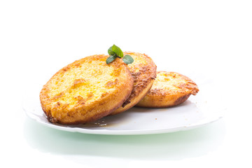 round bread croutons fried in batter in a plate