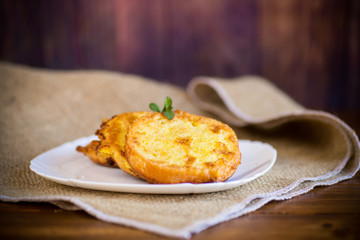 round bread croutons fried in batter in a plate