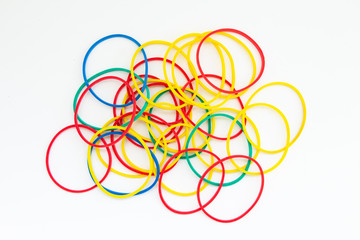 multi-colored rubber bands on a white background