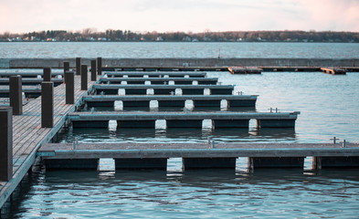 empty boat marina dock with the sunset pier on the lake