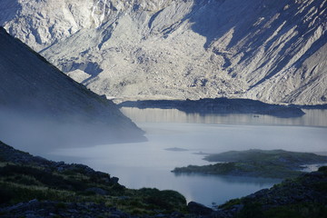 MOUNT COOK NATIONAL PARK, NEW ZEALAND - MARCH 13, 2020: Mist above Mueller lake with Mount Sefton in the background