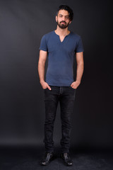 Obraz premium Full body shot of handsome bearded Persian man