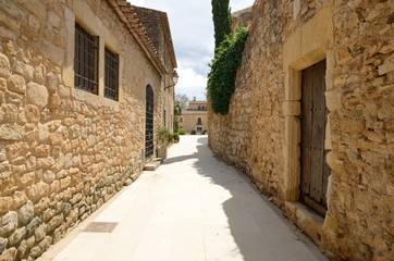 Fototapeta na wymiar Stone alley in Girona village, Spain