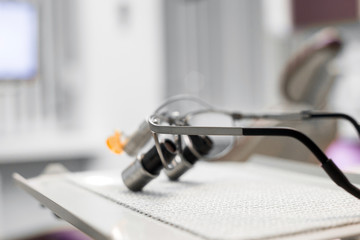 Obraz na płótnie Canvas Glasses-microscope of the dentist, spectacles magnifying binocular