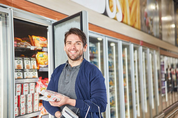 Consumers on the refrigerated shelves buy frozen foods