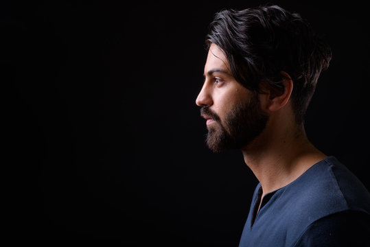 Profile view of handsome bearded Persian man