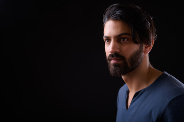 Fototapeta premium Face of handsome bearded Persian man thinking