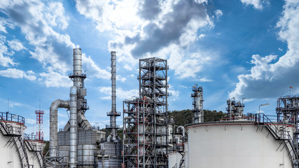 Oil and gas refinery plant and storage tank form industry zone with blu sky background, Oil and gas Industrial petrochemical fuel power and energy, Ecosystem and ecology environment.