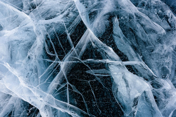 Beautiful ice of Lake Baikal with abstract cracks