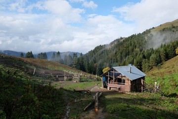 Shepherd's hut in mountains on the route from the Mt. Megruki peak to Atskuri. Borjomi-Kharagauli National Park, Georgia. 