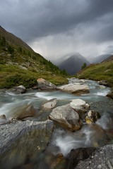 landscape with a river high in the mountains, swiss alps
