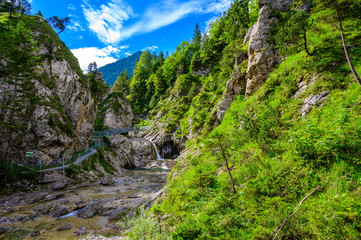 Fototapeta na wymiar Beautiful scenery of Stuibenfälle - River and waterfall at Reutte in mountain scenery of Alps, Austria