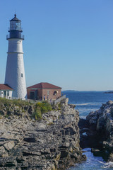 Fototapeta na wymiar Cape Elizabeth, Maine, USA: Tourists visit the Portland Head Light, 1791, the oldest lighthouse in Maine.