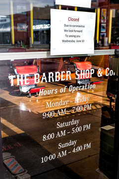 Herndon, USA - April 9, 2020: Virginia Fairfax County with barber shop store closed business company sign and entrance during corona virus