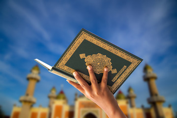 
Quran - holy book of Muslims religion, Concept: open book holy prayers for god,
 Friday In the month of Ramadan  religion Islamic worshiping faith and learn koran and rosary put on wooden  boards  - obrazy, fototapety, plakaty