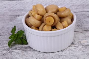 Pickled champignon heap in the bowl