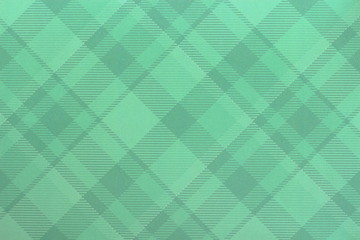 A close up color image of green plaid card stock used for crafting projects and card making.