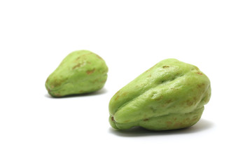 Two bitter melons/bitter gourds (Momordica charantia) isolated on white background