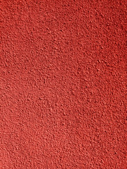 Monochrome brick red color concrete wall textured background. Close up. House wall in sunny day.