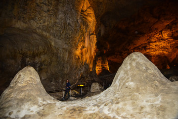 Calcite inlets, stalactites and stalagmites in large underground halls in Carlsbad Caverns National...